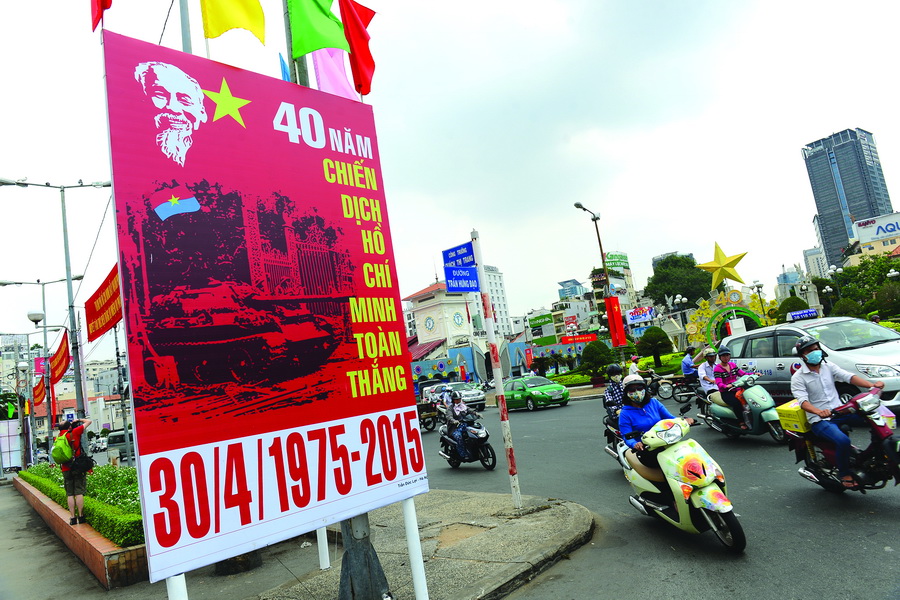 A banner celebrating the 40th anniversary of Reunification Day on April 30 is seen on Tran Hung Dao Street in District 1.