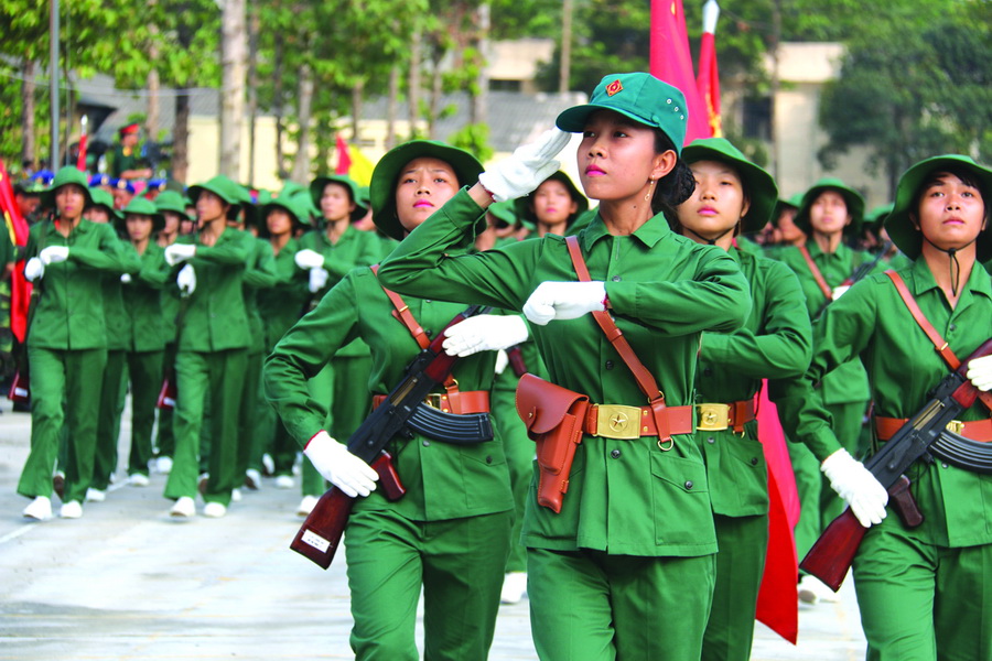 Members of the people's armed forces are captured rehearsing for a parade slated for April 30.