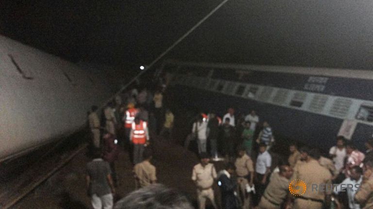 India floods derail two trains, killing at least 20; hundreds rescued