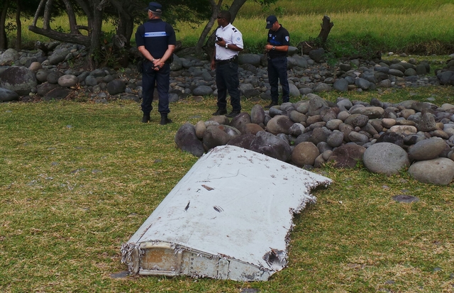 Wing part washed up on beach is from missing MH370, Malaysia confirms