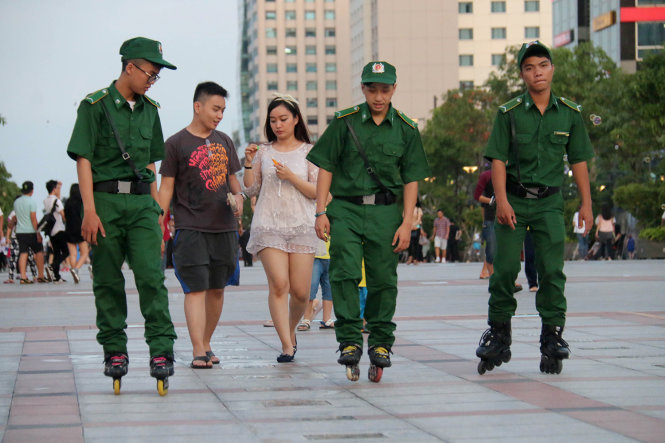 Security guards skate for faster patrol in downtown Ho Chi Minh City