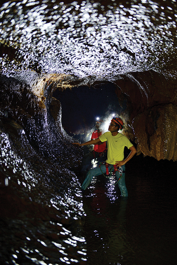 Two explorers inside Va Cave.