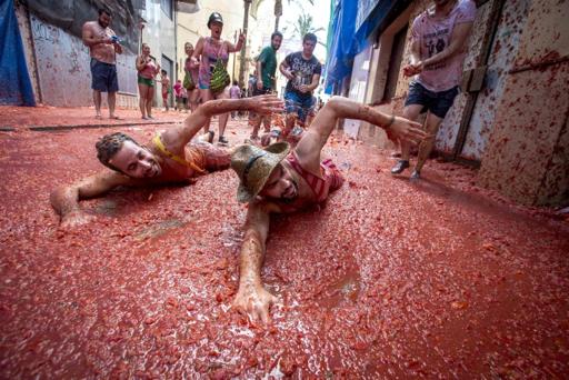 Annual tomato battle paints streets of Spanish town red