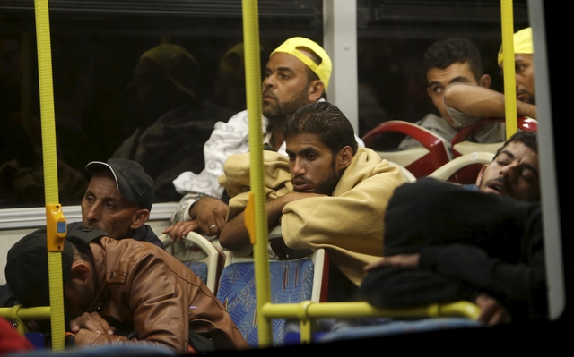 Migrants enter Austria, swept west by overwhelmed Hungary