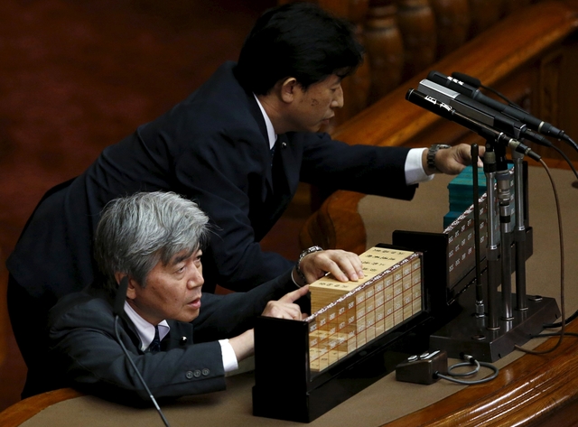Japan enacts bills easing pacifist constitution's limits on military