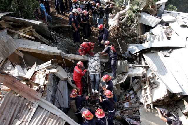 Hillside collapses on Guatemalan town, killing 26; hundreds missing
