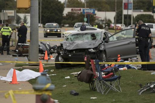 Four dead after car smashes into US parade crowd