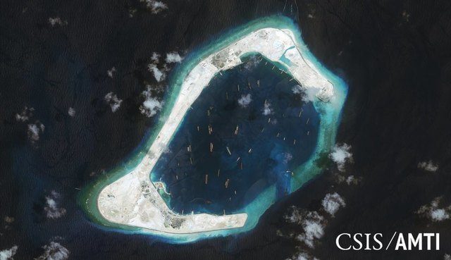 Angry China shadows U.S. warship near man-made islands