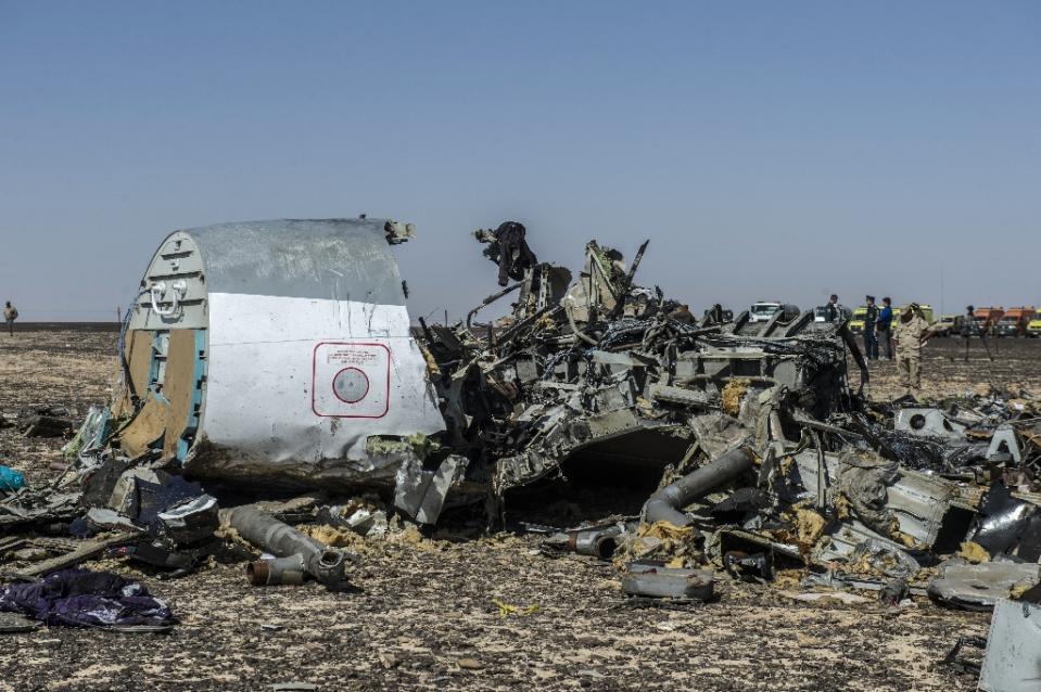 Russia plane 'broke up in air', bodies flown home from Egypt