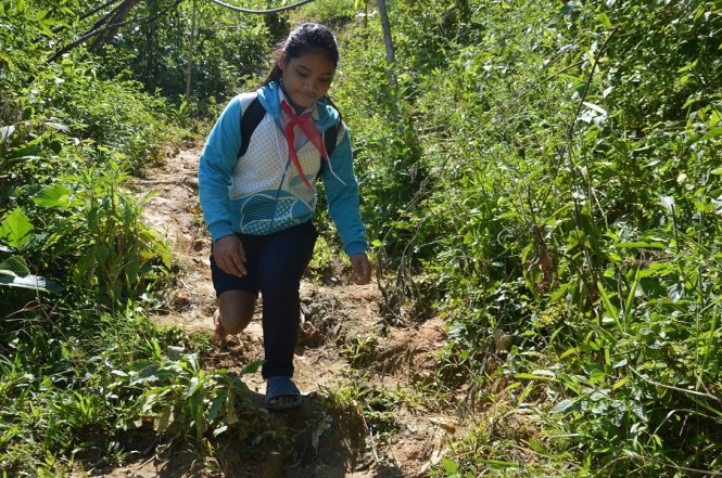 Fatherless Vietnamese girl hops across forest to school for 9 years