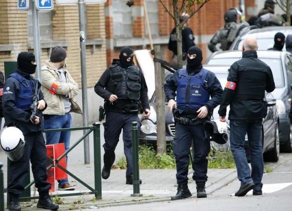 France police raid homes, vow it's 'just the beginning'