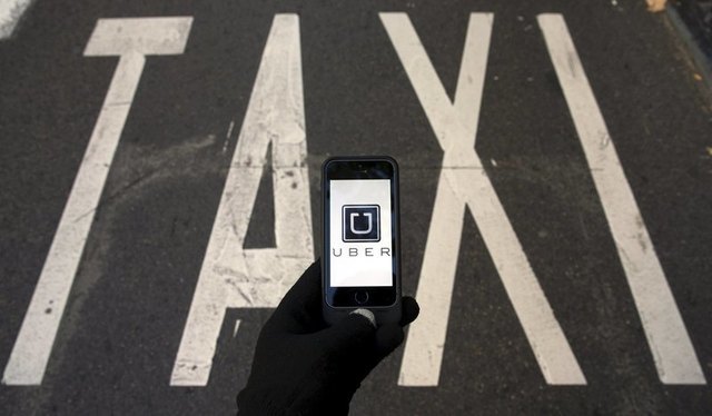 Taxi owners, lenders sue New York City over Uber