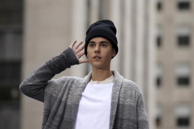 Justin Bieber storms UK charts to equal John Lennon's 1981 feat