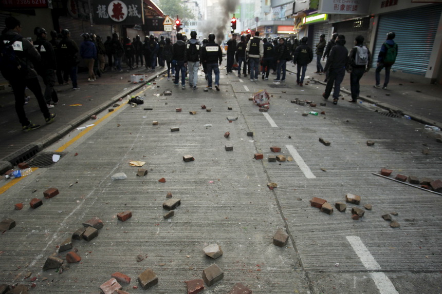 Hong Kong riot police clash with protesters amid crackdown on street vendors