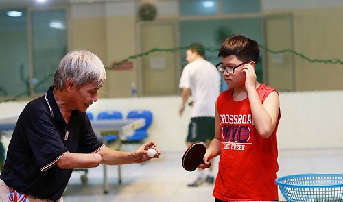In Vietnam, one-handed table tennis coach lives with burning passion, optimism