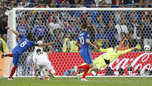 France strike late to beat Albania and go through