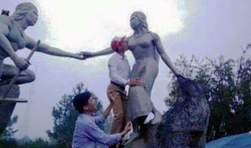 Vietnam official sparks moral outrage for kissing breast of legendary statue