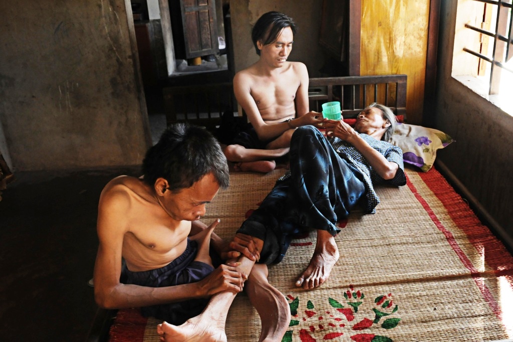 Nguyen Van Hai and Nguyen Van Hien look after their mother when she gets sick. 