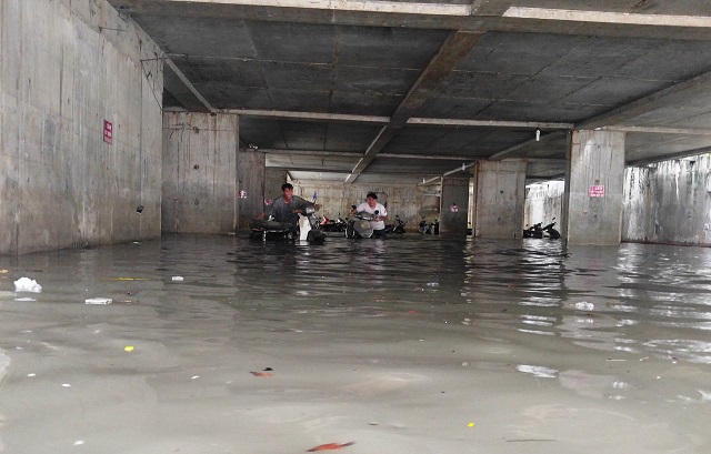 Issues emerge as heavy storms flood parking basements in Ho Chi Minh City