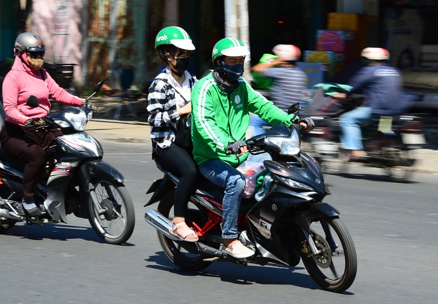 In Ho Chi Minh City, traditional motorbike taxi drivers grapple with technology invasion