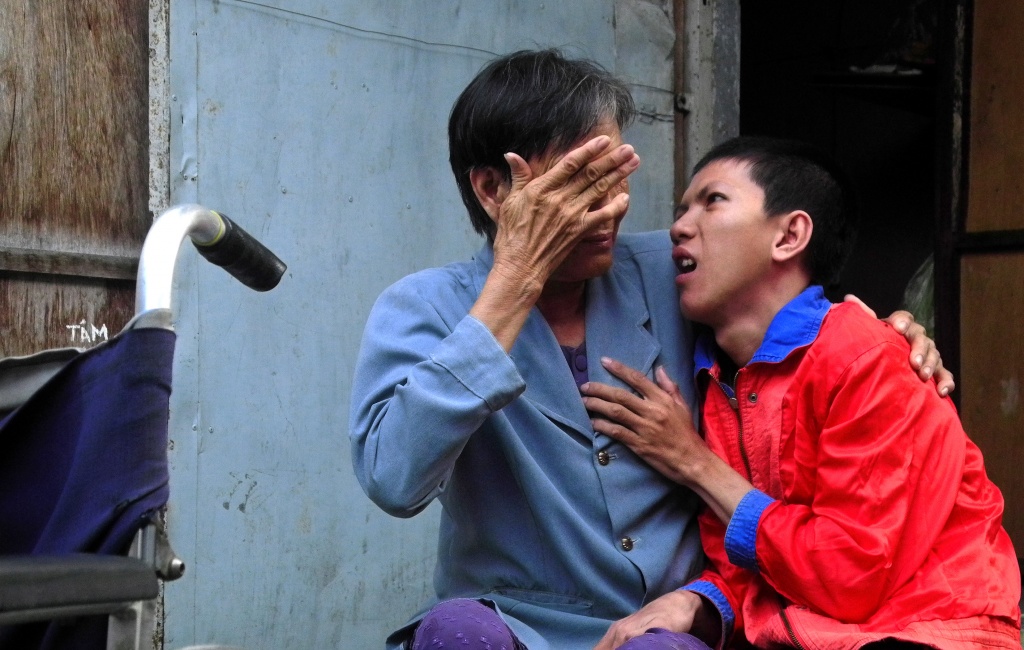 Elderly Vietnamese woman sells lottery tickets to support disabled nephew