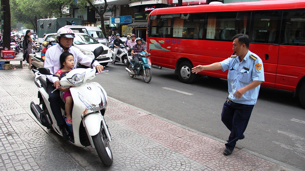 Hundreds fined as Saigon puts the brakes on sidewalk driving