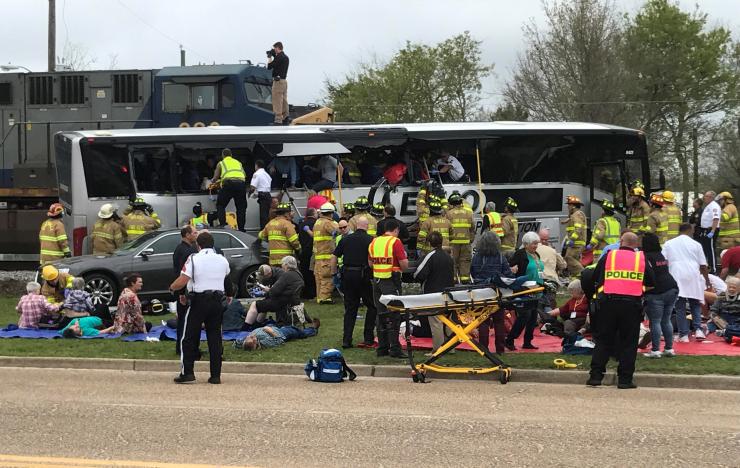Four killed when freight train hits bus in Mississippi