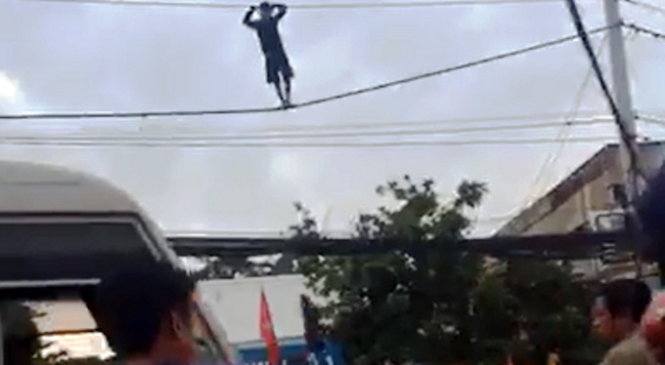 Man under the influence of meth turns tightrope walker in Saigon