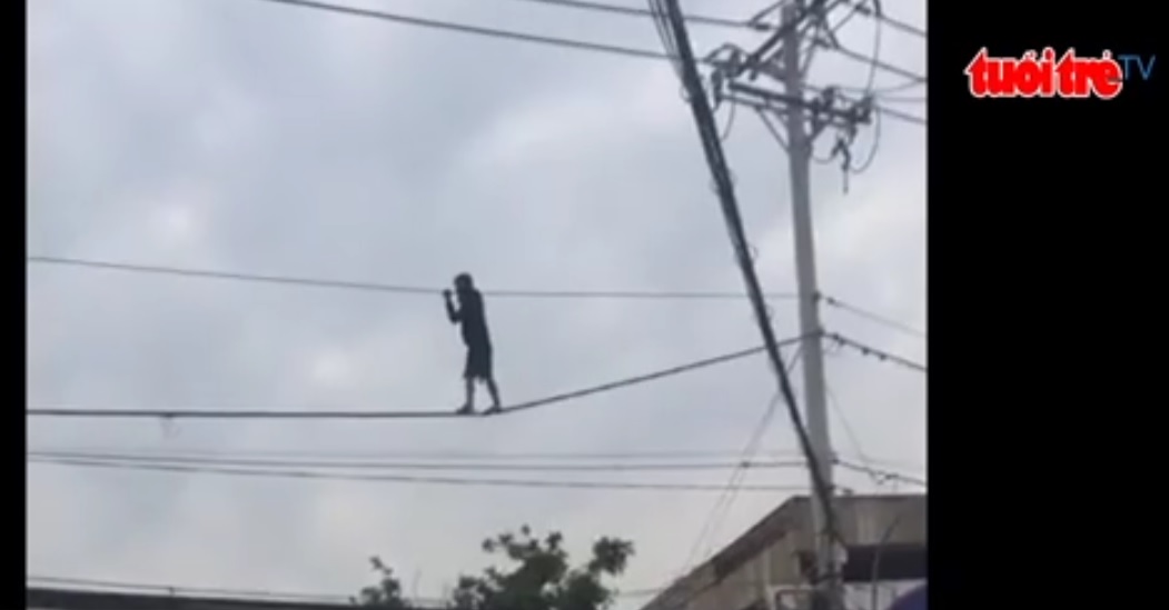 In Vietnam, high wire stuntman suspected of being on drugs