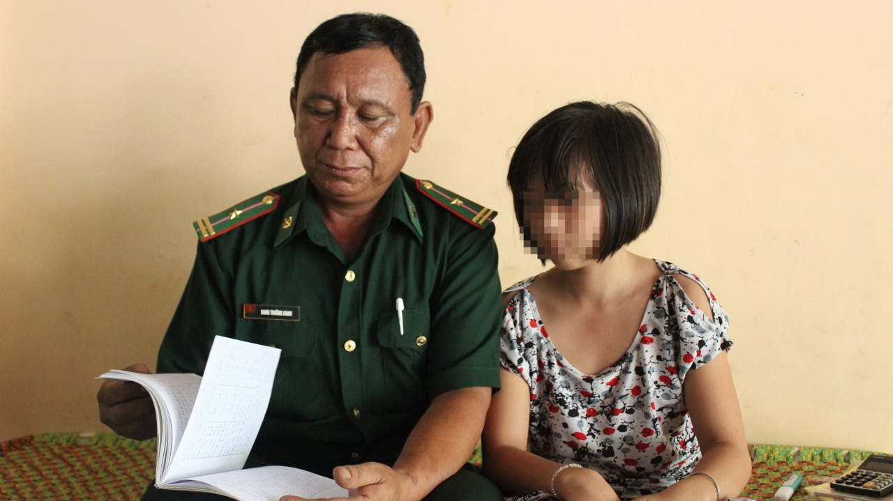 In Vietnam, officer adopts HIV-infected children of deceased comrade