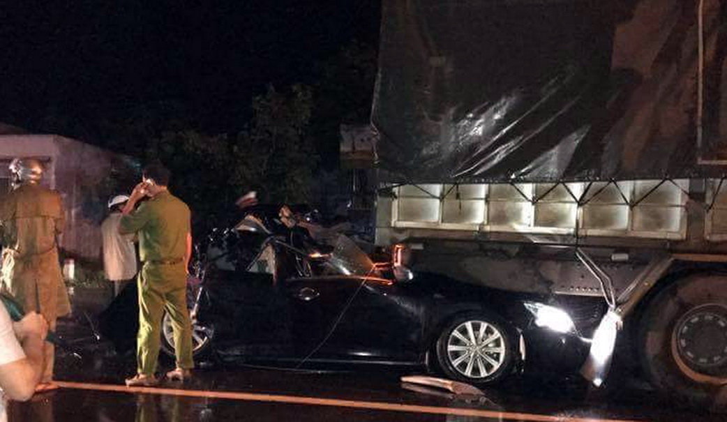 Two Vietnamese policemen killed as car crushed between two trucks