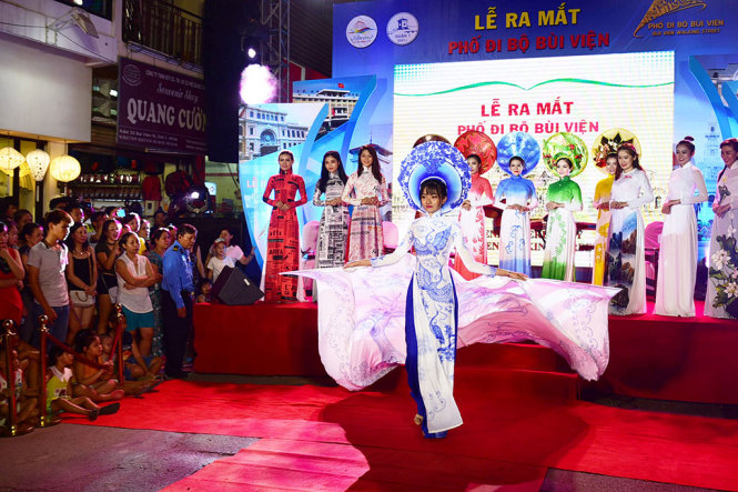 Models are seen during an ao dai show.