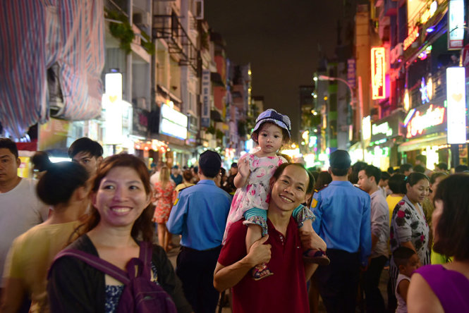 Locals are seen at the Bui Vien Walking Street.