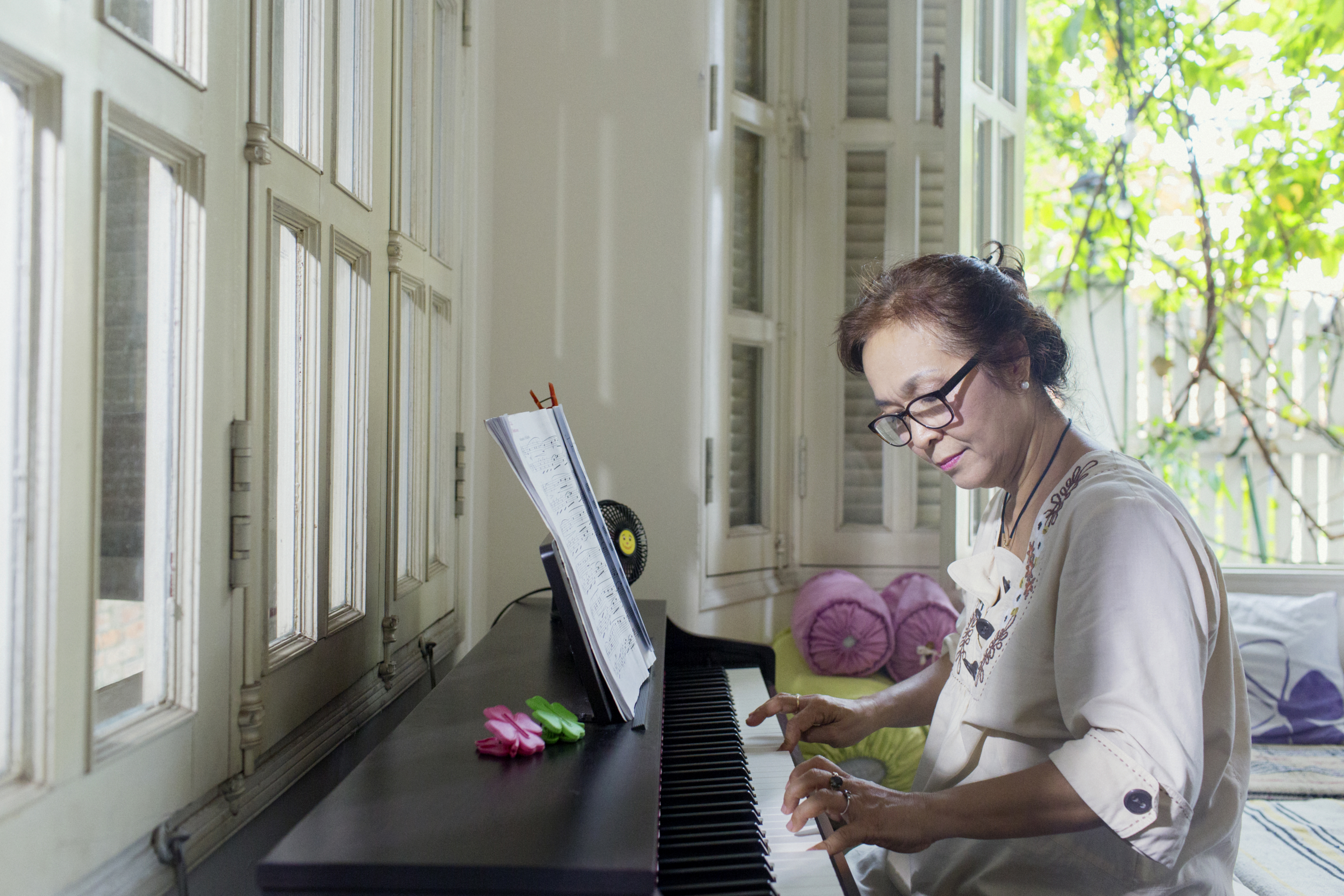 Hua Thanh Giang, 58 years old – playing the piano