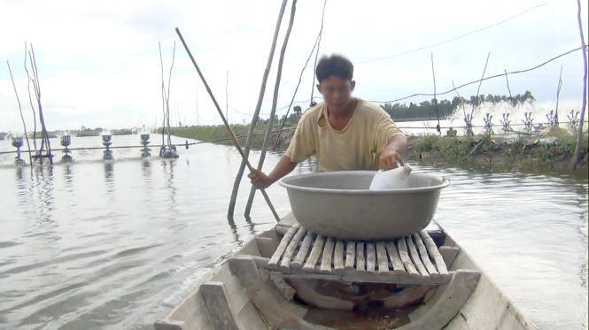 ​Vietnamese farmers mix salt with water to raise shrimp