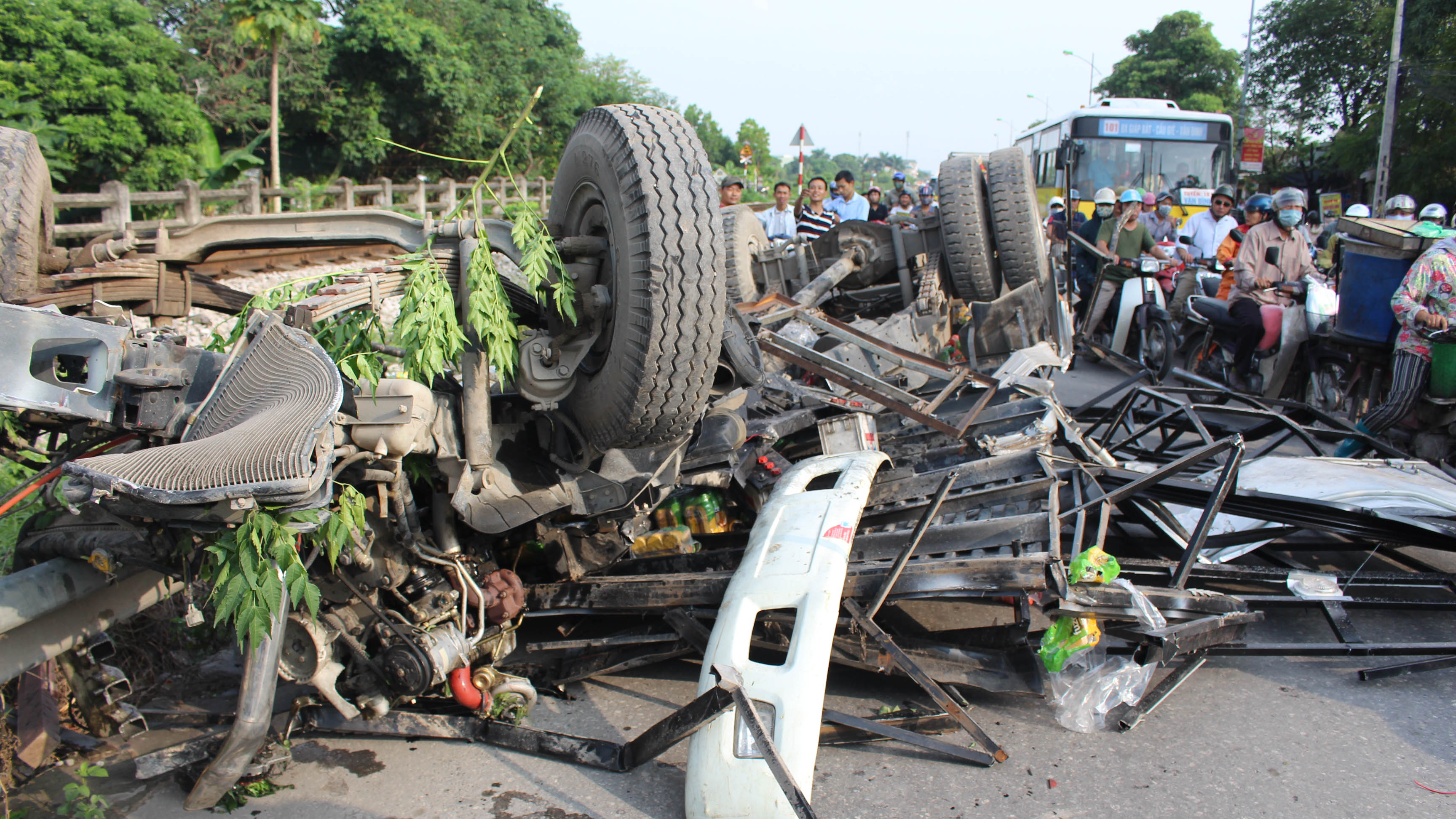 ​Driver goes unscathed as truck crushed by train in Hanoi