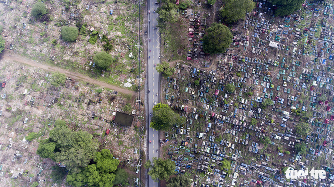 A street passing a graveyard. Captured at Tan Ky Tan Quy Street, Tan Phu District.