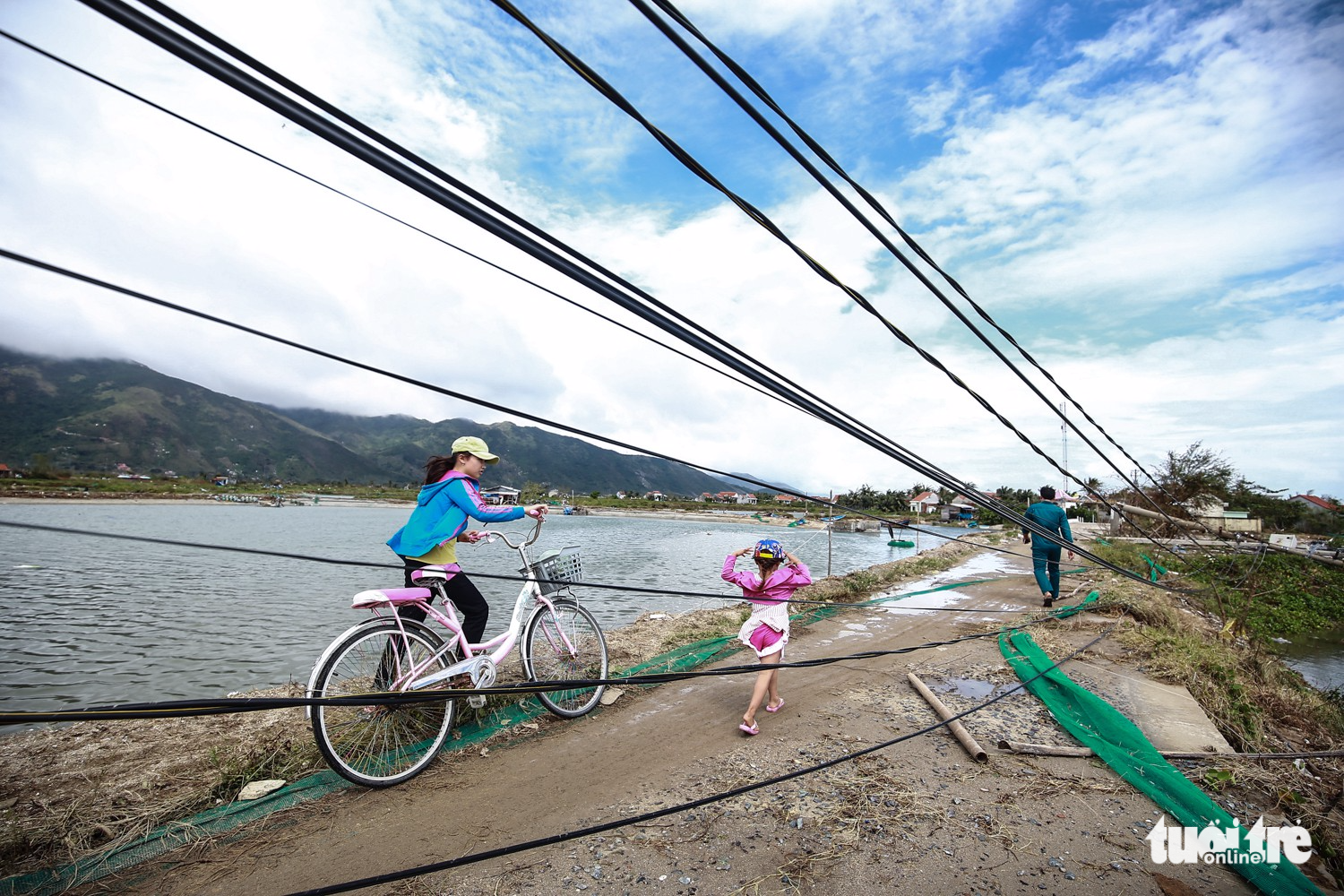 Electric wires lie near the ground in Van Phuoc Commune after the storm.