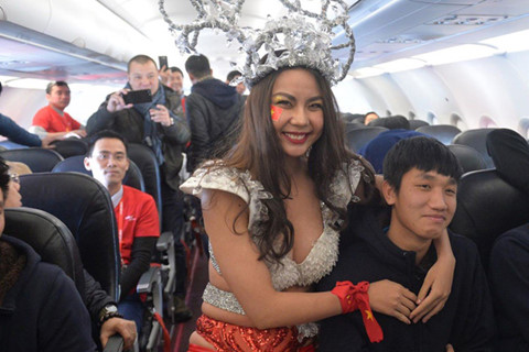 Vietnam culture ministry to probe bikini show on plane carrying U23 footballers home