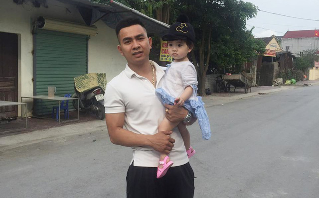 Nguyen Vo Cuong Bach with a kid. Photo courtesy of Bach
