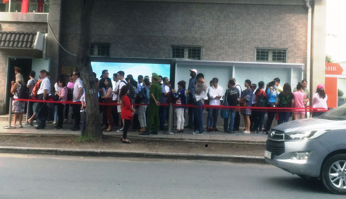Middlemen sell queue tickets in front of Chinese Consulate General in Ho Chi Minh City