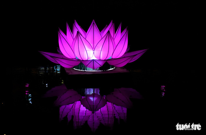 One of the seven large lotus-shaped lanterns by Quan Am Monastery is seen on Nhieu Loc – Thi Nghe Canal in Ho Chi Minh City. Photo: Tuoi Tre