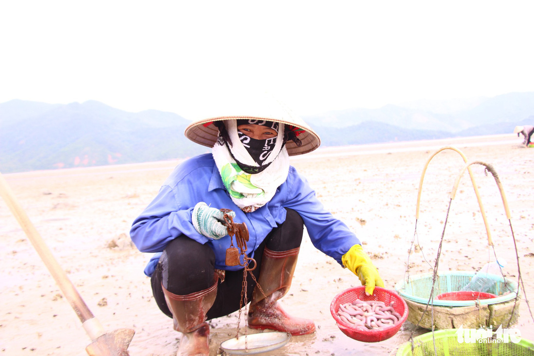 ​Women earn a living digging for peanut worms in northern Vietnam