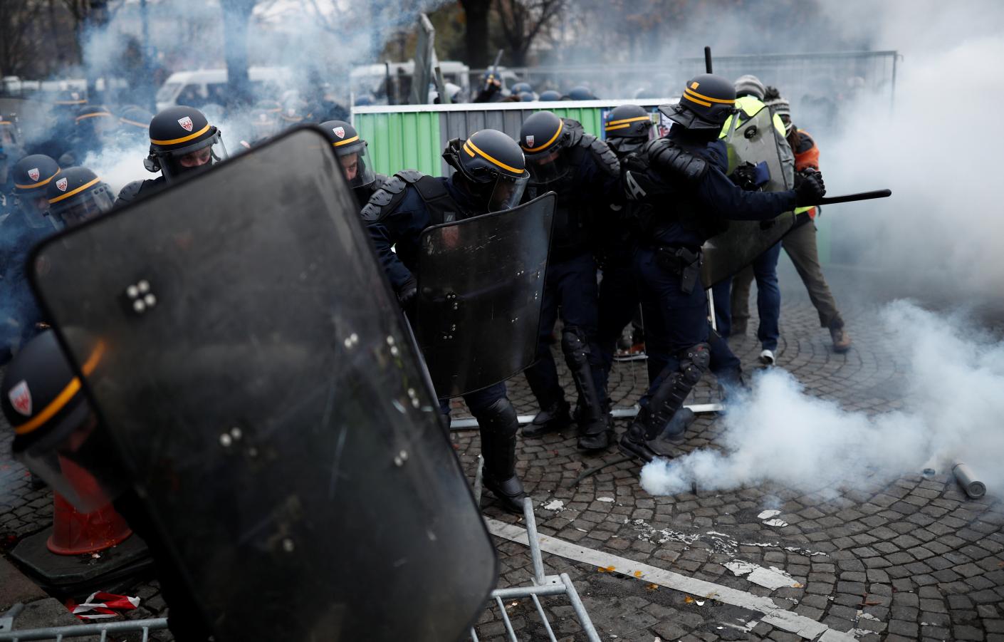 French police clash violently with protesters on Champs Elysees over petrol costs