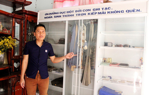 With love, against tradition, Vietnamese man keeps mementos of late father in cabinet