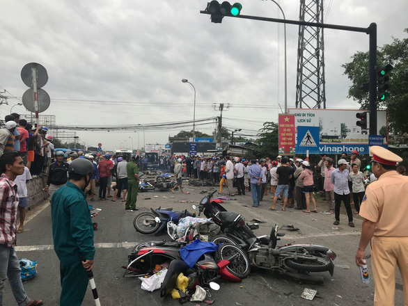 At least four dead after truck rams 21 motorbikes at traffic light in Vietnam