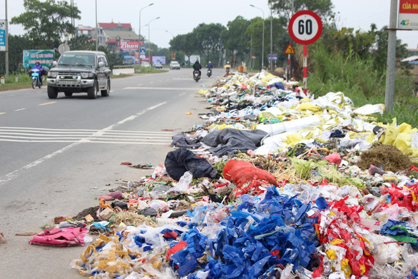 Piles of illegally dumped trash occupied Hanoi street
