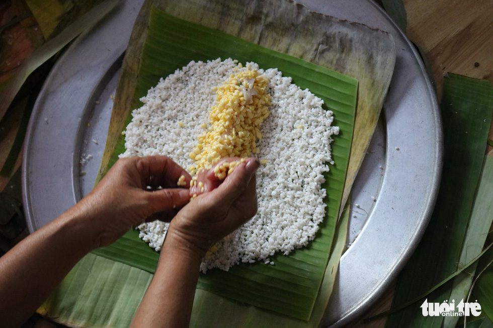Saigon family preserves Tet tradition with homemade ‘banh tet’