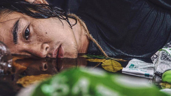 Man ‘drowns in garbage’ in haunting photo album by Vietnamese make-up artist
