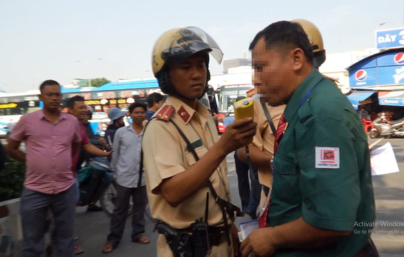 Police test drivers for drug, alcohol use at major bus station in Saigon